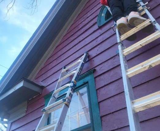 BBB project photo showing exterior ladder work on a house